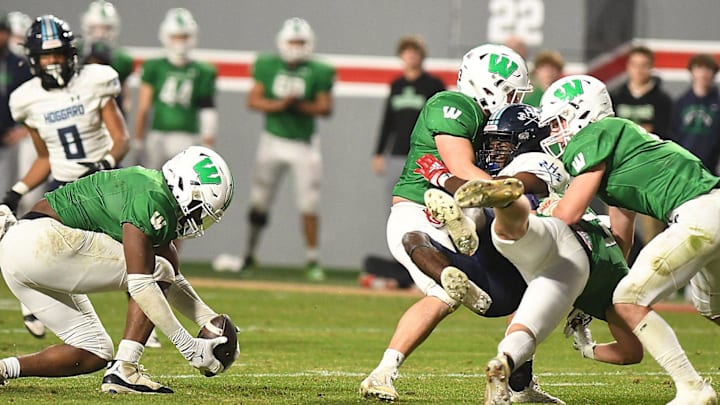 Weddington's #6 Aiden Harris intercepts the ball as Hoggard took on Weddington High School in the 4A Football Championship at Carter-Finley Stadium in Raleigh Saturday Dec. 9, 2023. Weddington beat Hoggard 56 -21 to win the State Championship. KEN BLEVINS/STARNEWS