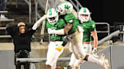 Weddington's #0 TJ Davis took the ball in for a touchdown after a blocked punt as Hoggard took on Weddington High School in the 4A Football Championship at Carter-Finley Stadium in Raleigh Saturday Dec. 9, 2023. Weddington beat Hoggard 56 -21 to win the State Championship. KEN BLEVINS/STARNEWS