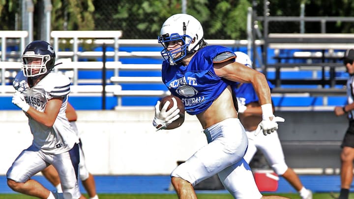 Scituate   s Lawson Foley finds a lot of running room on his way to his touchdown during their scrimmage against Cohasset at Scituate High on Saturday, Aug. 26, 2023.