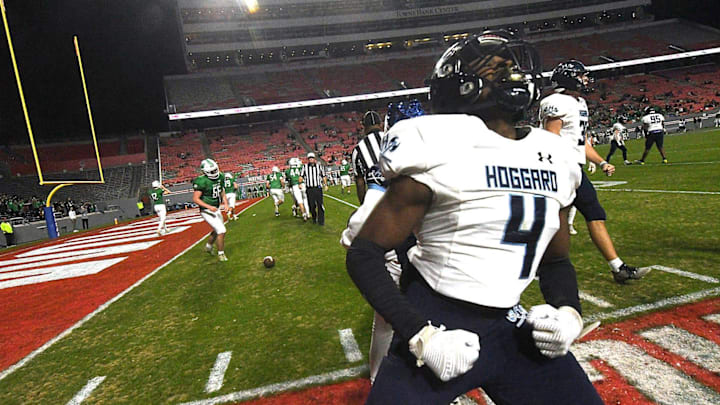 Hoggard' #4 Trey Nixon reacts after intercepting the ball as Hoggard took on Weddington High School in the 4A Football Championship at Carter-Finley Stadium in Raleigh Saturday Dec. 9, 2023. Weddington beat Hoggard 56 -21 to win the State Championship. KEN BLEVINS/STARNEWS
