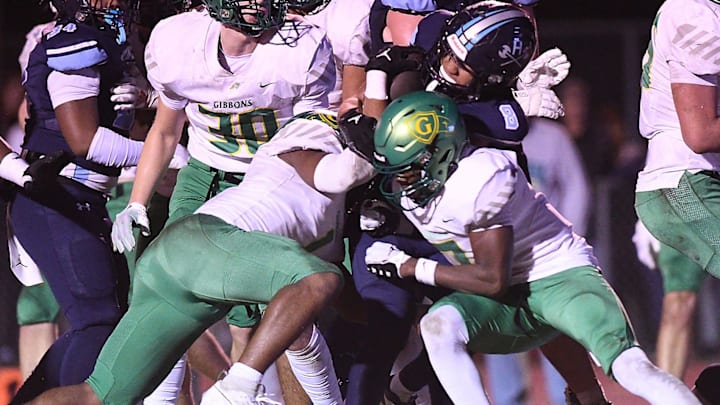 Hoggard's #8 Tamear Webb fights for yards as Hoggard took on Cardinal Gibbons in the 4A State Playoff Semi Final game Friday Dec. 1, 2023 at Hoggard's Scott Braswell Stadium in Wilmington, N.C. Hoggard won 41-20 to become the 2023 NCHSAA 4A East Champions. KEN BLEVINS/STARNEWS