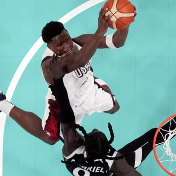 Jul 31, 2024; Villeneuve-d'Ascq, France; United States guard Anthony Edwards (5) shoots against South Sudan power forward Wenyen Gabriel (9) in the third quarter during the Paris 2024 Olympic Summer Games at Stade Pierre-Mauroy. 