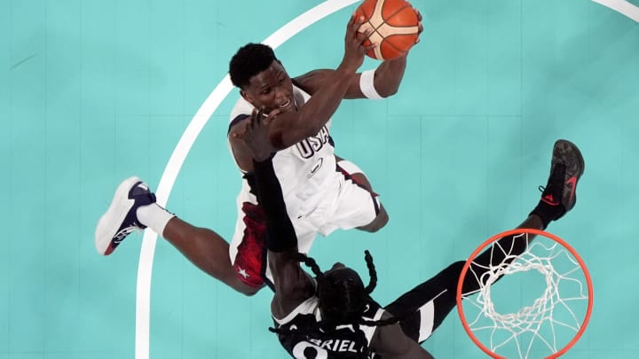 Jul 31, 2024; Villeneuve-d'Ascq, France; United States guard Anthony Edwards (5) shoots against South Sudan power forward Wenyen Gabriel (9) in the third quarter during the Paris 2024 Olympic Summer Games at Stade Pierre-Mauroy. 