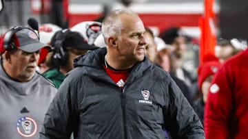 Nov 29, 2025; Raleigh, North Carolina, USA; NC State Wolfpack head coach Dave Doeren reacts during the first half of the game against North Carolina Tar Heels at Carter-Finley Stadium.  Mandatory Credit: Jaylynn Nash-Imagn Images