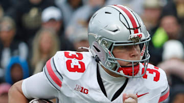 Ohio State Buckeyes quarterback Devin Brown (33) rushes the ball during the NCAA football game