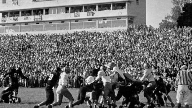 George Parker attempts a kick during a 1948 contest at the original Memorial Stadium, which was located on 10th Street. Today