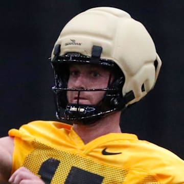 Purdue Boilermakers quarterback Ryan Browne (15) throws the ball