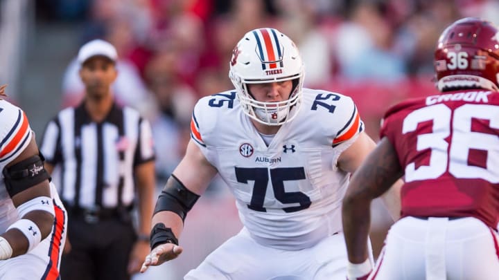 Auburn Tigers offensive lineman Connor Lew blocks against the Arkansas Razorbacks