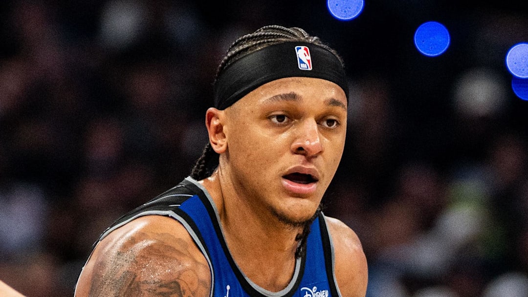 May 1, 2026; Orlando, Florida, USA; Orlando Magic forward Paolo Banchero (5) dribbles the ball against Detroit Pistons forward Duncan Robinson (55) in the fourth quarter during game six of the first round of the 2026 NBA Playoffs at Kia Center. Mandatory Credit: Jeremy Reper-Imagn Images