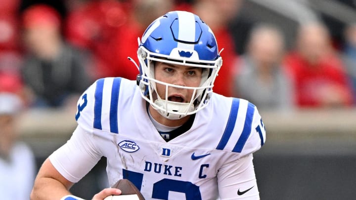 Oct 28, 2023; Louisville, Kentucky, USA;  Duke Blue Devils quarterback Riley Leonard (13) looks to pass during the first half against the Louisville Cardinals at L&N Federal Credit Union Stadium. Louisville defeated Duke 23-0.