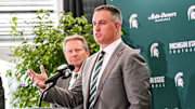 Michigan State's new football coach Pat Fitzgerald, right,, talks during his introductory press conference on Tuesday, Dec. 2, 2025, at the Tom Izzo Football Building in East Lansing.