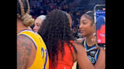 Chicago Sky star Angel Reese talks to Candace Parker after a game.
