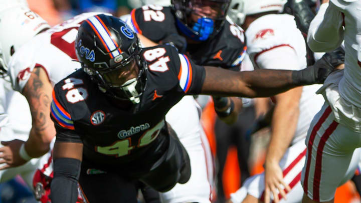 Florida Gators defensive end Quincy Ivory (48) almost blocks a punt by Arkansas Razorbacks punter Max Fletcher (31) at Steve Spurrier Field at Ben Hill Griffin Stadium in Gainesville, FL on Saturday, November 4, 2023 in the first half against Arkansas. [Doug Engle/Gainesville Sun]