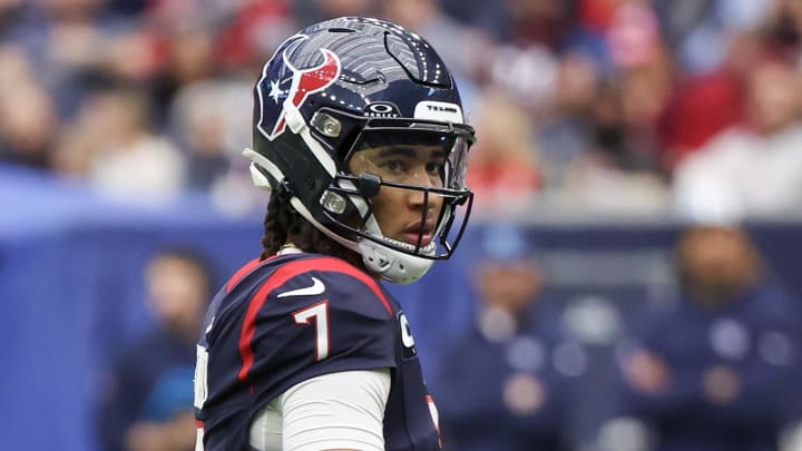 Dec 31, 2023; Houston, Texas, USA; Houston Texans quarterback C.J. Stroud (7) looks at his play card while playing against the Tennessee Titans in the first quarter at NRG Stadium. Mandatory Credit: Thomas Shea-USA TODAY Sports