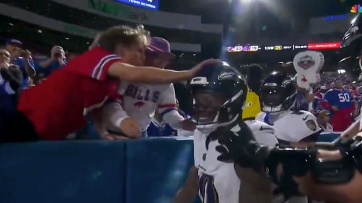 The fan in the red has been indefinitely banned from NFL stadiums.