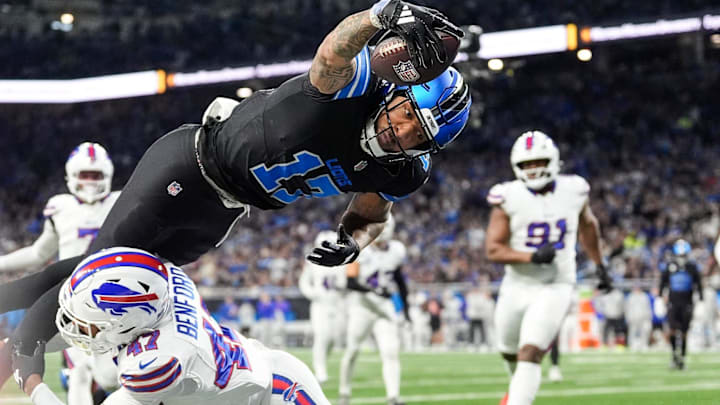 Detroit Lions wide receiver Tim Patrick (17) dives for a touchdown against Buffalo Bills cornerback Christian Benford (47) during the first half at Ford Field in Detroit on Sunday, Dec. 15, 2024.