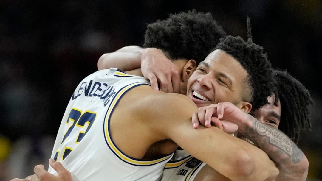 Michigan Wolverines forward Yaxel Lendeborg (23) and Wolverines guard Trey McKenney (1) 