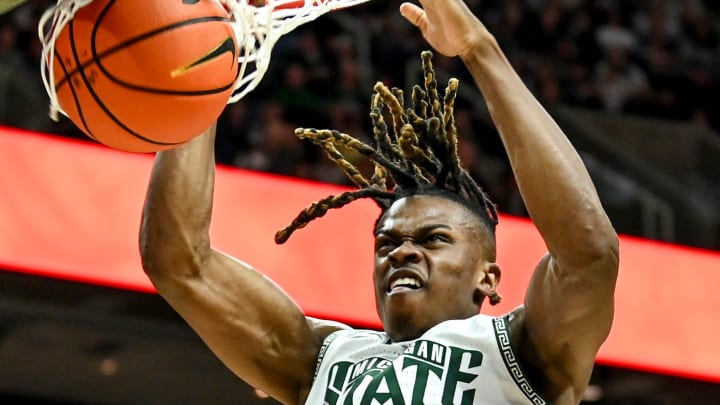 Michigan State's Coen Carr dunks against Maryland during the first half on Saturday, Feb. 3, 2024, at the Breslin Center in East Lansing.