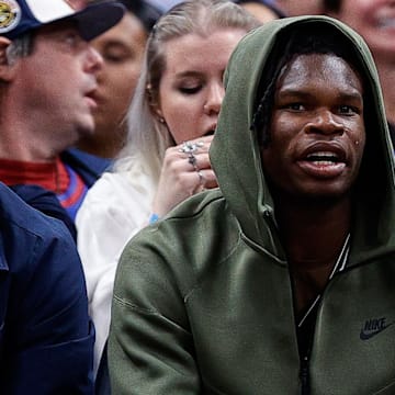 Oct 24, 2023; Denver, Colorado, USA; University of Colorado Buffaloes football players Shedeur Sanders (L) and Travis Hunter (R) watch during the third period between the Denver Nuggets and the Los Angeles Lakers at Ball Arena. Mandatory Credit: Isaiah J. Downing-Imagn Images
