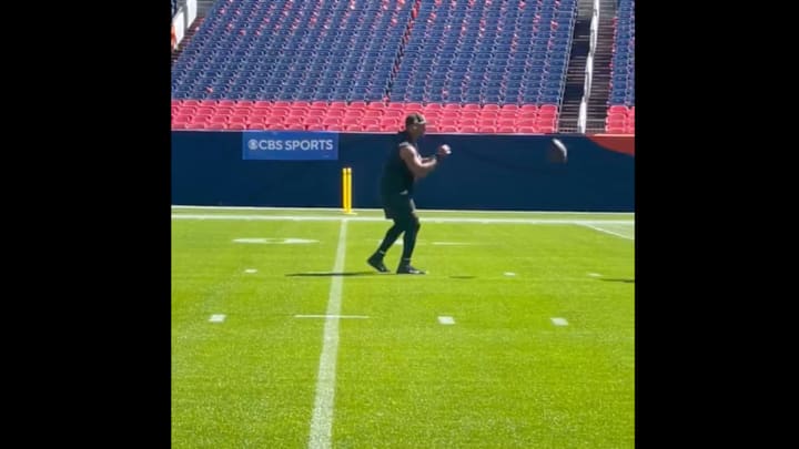 Russell Wilson warms up alone ahead of the Steelers second game of the season.