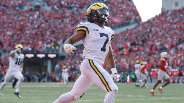 Michigan Wolverines back Donovan Edwards runs against the Ohio State Buckeyes in this college football game in the Big Ten.