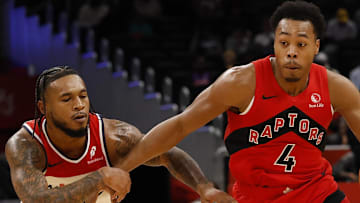Toronto Raptors forward/guard Scottie Barnes drives to the basket as Washington Wizards forward Cam Whitmore.