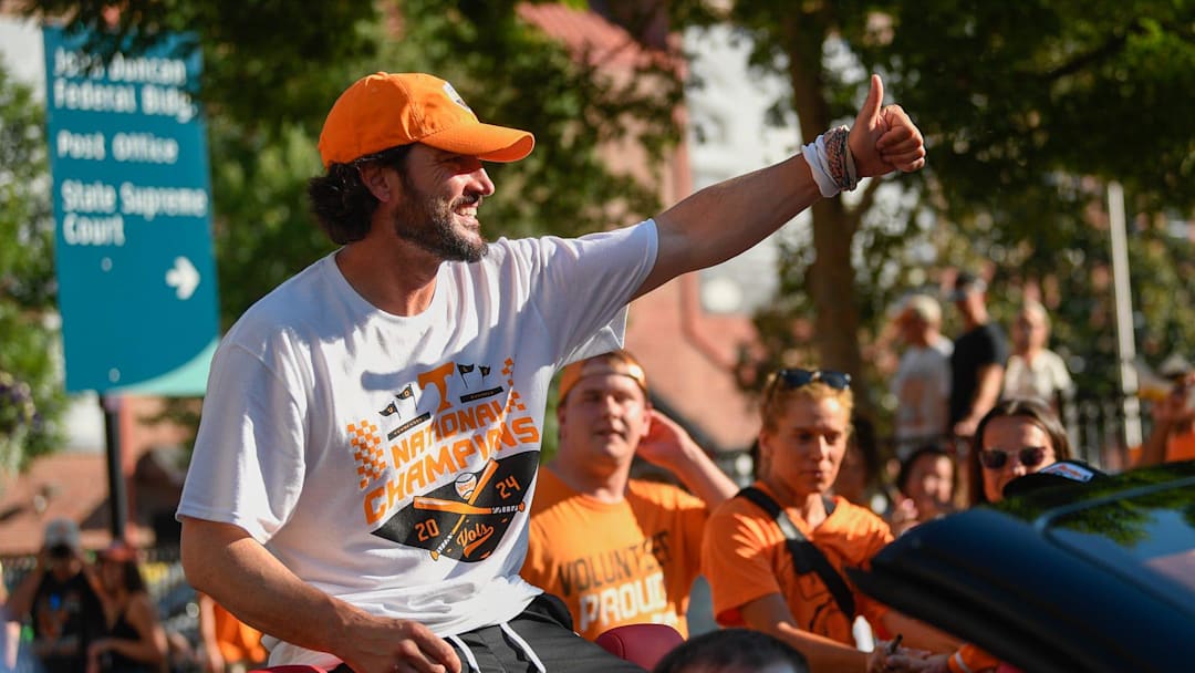 Vols head coach Tony Vitello waves to fans during the Knoxville homecoming parade in the team's honor after winning the baseball World Series, Tuesday, June 25, 2024.