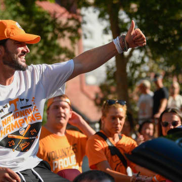 Vols head coach Tony Vitello waves to fans during the Knoxville homecoming parade in the team's honor after winning the baseball World Series, Tuesday, June 25, 2024.
