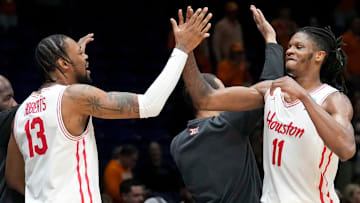 Houston forwards J'Wan Roberts (left) and Joseph Tugler high-five following the Cougars' Midwest Regional title-game win against Tennessee on March 30, 2025.
