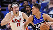 Orlando Magic forward Tristan da Silva drives past Miami Heat forward Jaime Jaquez Jr.