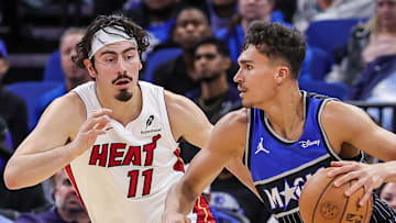 Orlando Magic forward Tristan da Silva drives past Miami Heat forward Jaime Jaquez Jr.