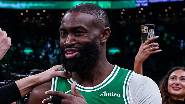 Mar 18, 2026; Boston, Massachusetts, USA; Boston Celtics guard Jaylen Brown (7) talks with Golden State Warriors center Kristaps Porzingis (7) after the game at TD Garden. Mandatory Credit: David Butler II-Imagn Images