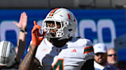 Nov 22, 2025; Blacksburg, Virginia, USA; Miami (FL) Hurricanes running back Mark Fletcher Jr. (4) celebrates a touchdown against the Virginia Tech Hokies during the second quarter at Lane Stadium. Mandatory Credit: Brian Bishop-Imagn Images