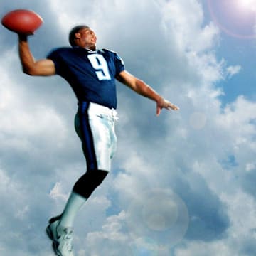Tennessee Titans star quarterback Steve McNair shows off his passing form as he poses for the camera at the team's facility Aug. 21, 2000.

082100 Steve Mcnair