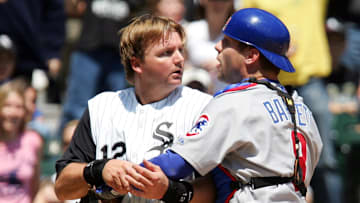 Chicago Cubs catcher Michael Barrett (8) and A.J. Pierzynski (12) argue with each other after Pierzynski scored a run during the second inning at US Cellular Field in Chicago, IL.  Mandatory Credit: Jerry Lai-Imagn Images © Copyright 2006 Jerry Lai