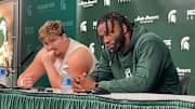Michigan State center Matt Gulbin (left) and linebacker Jordan Hall (right) discuss the Spartans' 38-13 loss to UCLA after the game on Oct. 11, 2025.