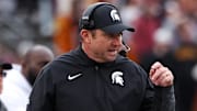 Nov 1, 2025; Minneapolis, Minnesota, USA; Michigan State Spartans head coach Jonathan Smith looks on during the first half against the Minnesota Golden Gophers at Huntington Bank Stadium. Mandatory Credit: Matt Krohn-Imagn Images