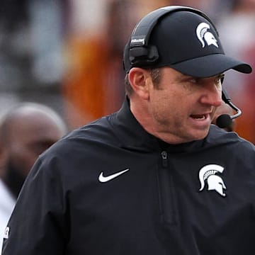 Nov 1, 2025; Minneapolis, Minnesota, USA; Michigan State Spartans head coach Jonathan Smith looks on during the first half against the Minnesota Golden Gophers at Huntington Bank Stadium. Mandatory Credit: Matt Krohn-Imagn Images