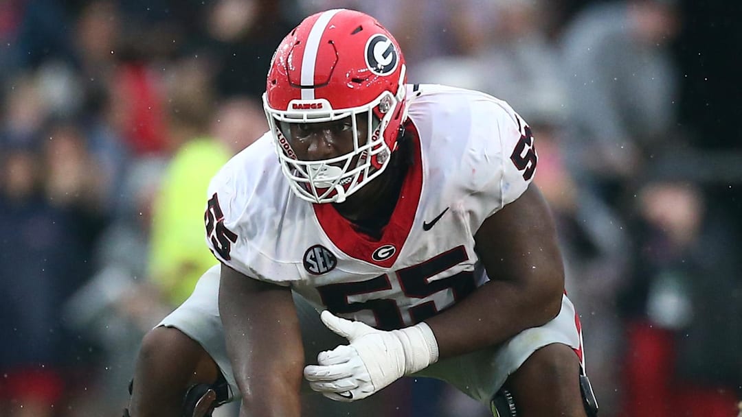 Nov 9, 2024; Oxford, Mississippi, USA; Georgia Bulldogs offensive lineman Jared Wilson (55) prepares to snap the ball during the first half against the Mississippi Rebels at Vaught-Hemingway Stadium. Mandatory Credit: Petre Thomas-Imagn Images