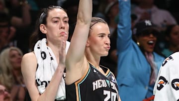 Sep 9, 2025; Brooklyn, New York, USA;  New York Liberty forward Breanna Stewart (30) and guard Sabrina Ionescu (20) celebrate from the bench in the fourth quarter against the Washington Mystics at Barclays Center. Mandatory Credit: Wendell Cruz-Imagn Images