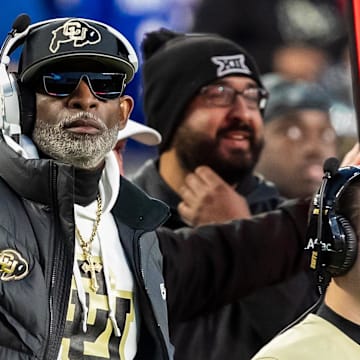 Nov 23, 2024; Kansas City, Missouri, USA;  Colorado head coach Deion Sanders watches the run of play during the 3rd quarter between the Kansas Jayhawks and the Colorado Buffaloes at GEHA Field at Arrowhead Stadium. Mandatory Credit: Nick Tre. Smith-Imagn Images