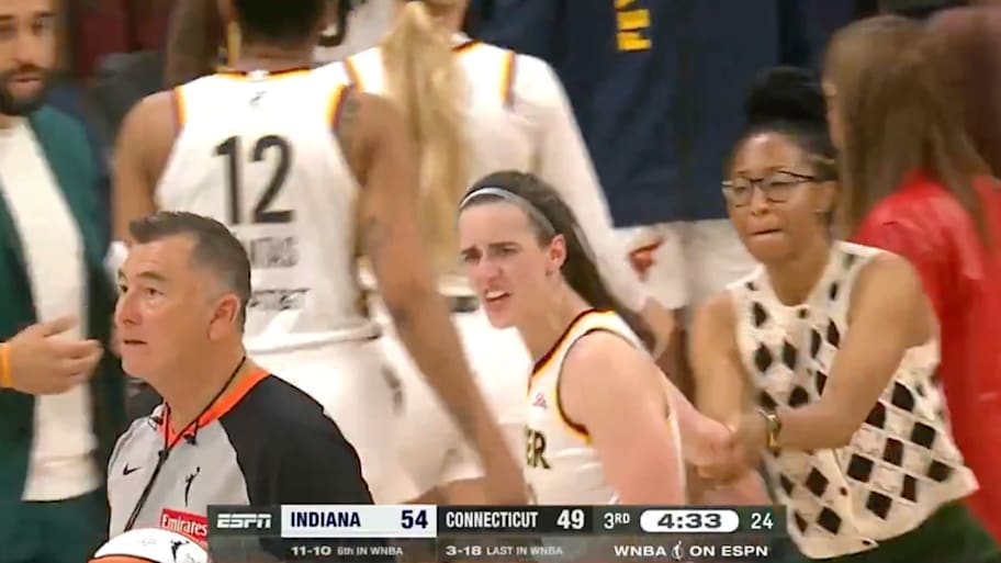 Caitlin Clark had to be held back by a coach during the Fever’s game against the Sun. | X.com