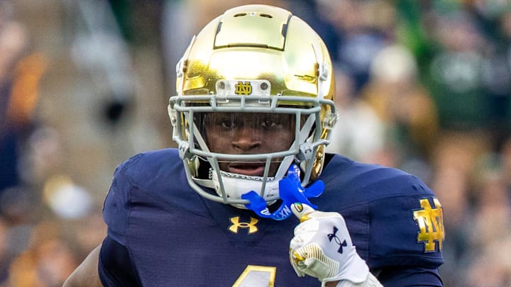 Nov 22, 2025; South Bend, Indiana, USA; Notre Dame Fighting Irish running back Jeremiyah Love (4) runs the ball against the Syracuse Orange during the first half at Notre Dame Stadium. Mandatory Credit: Michael Caterina-Imagn Images