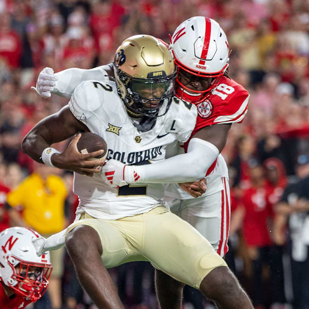 Nebraska linebacker Princewill Umanmielen sacks Colorado quarterback Shedeur Sanders.