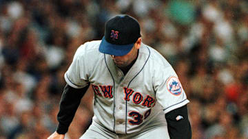 New York Mets pitcher Rick Reed knocks down a hit