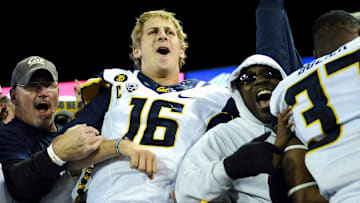 Jared Goff and teammates celebrate after win at WSU.