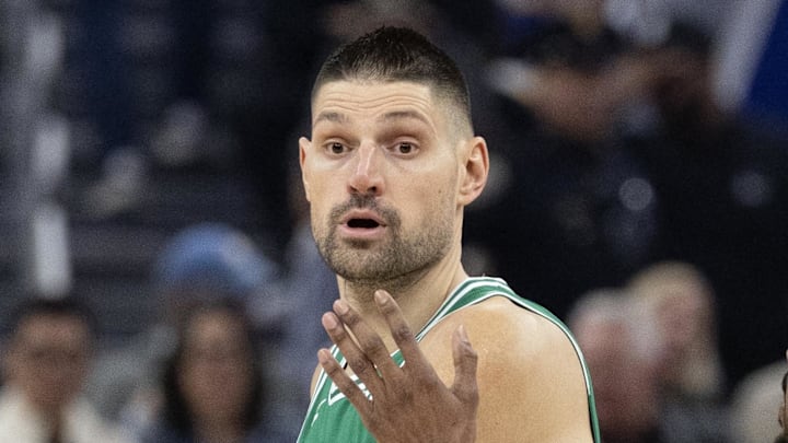 Feb 19, 2026; San Francisco, California, USA; Boston Celtics center Nikola Vucevic (4) looks to pass around Golden State Warriors guard De'Anthony Melton (8) during the first quarter at Chase Center. Mandatory Credit: D. Ross Cameron-Imagn Images