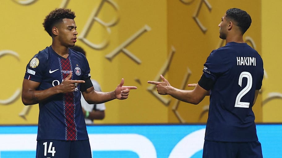Desire Doue (left) celebrates his decisive goal with Achraf Hakimi (right). | Kai Pfaffenbach-Reuters via Imagn Images