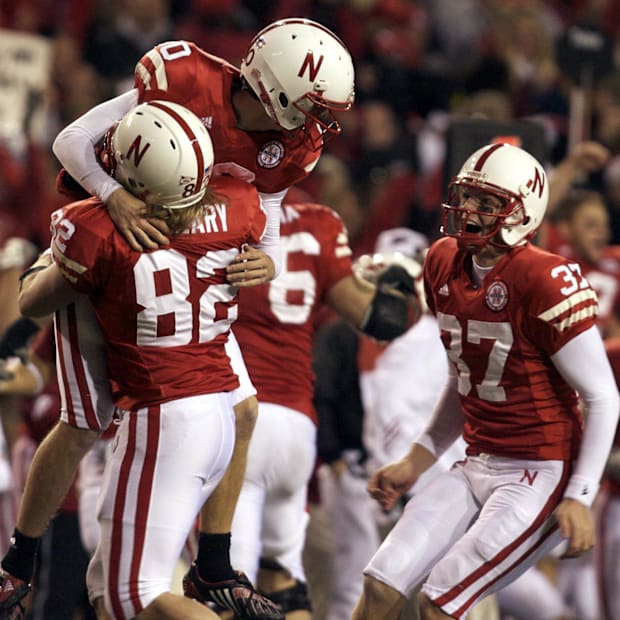 Alex Henery jumps into the arms of long snapper T.J. O'Leary after kicking the go-ahead field goal from 57 yards out