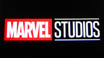 In this photo illustration a Marvel Studios logo is seen on...